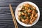 Three Cup Chicken, is a classic Taiwanese dish made by cookingÂ chickenÂ with sesame oil, soy sauce and rice wine close-up in a